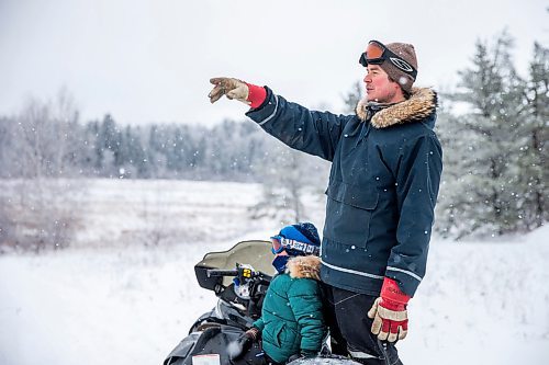 MIKAELA MACKENZIE / WINNIPEG FREE PRESS

Devin Imrie points out a beaver house to his son, Thomas, while out on their trapline near Falcon Lake, Manitoba on Tuesday, Jan. 28, 2020. 
Winnipeg Free Press 2019.