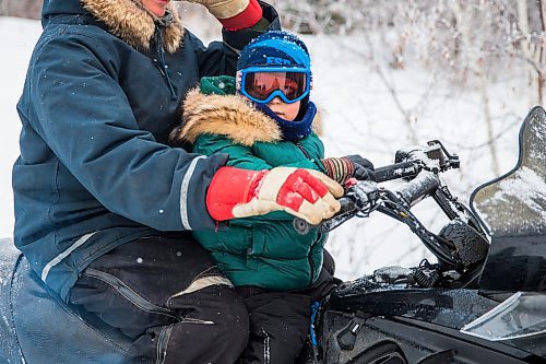 MIKAELA MACKENZIE / WINNIPEG FREE PRESS

Thomas Imrie, five, gets to ride in front of his dad while out on their trapline near Falcon Lake, Manitoba on Tuesday, Jan. 28, 2020. 
Winnipeg Free Press 2019.