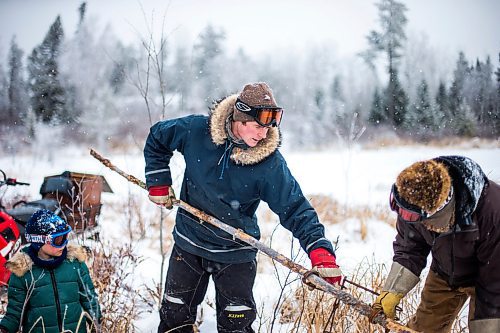 MIKAELA MACKENZIE / WINNIPEG FREE PRESS

Devin Imrie sets a new beaver trap with help from his dad, Murray, on their trapline near Falcon Lake, Manitoba on Tuesday, Jan. 28, 2020. 
Winnipeg Free Press 2019.