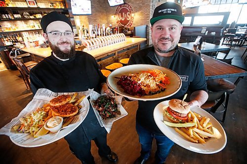 JOHN WOODS / WINNIPEG FREE PRESS
Dennis Burnett, kitchen manager, left, and Jay Kilgour, owner and GM, show off some of the many plant based meat-like products on the menu at Fionn MacCools Crossroad and Grant Park restaurants in Winnipeg Thursday, January 30, 2020. 

Reporter: Scott-Reid