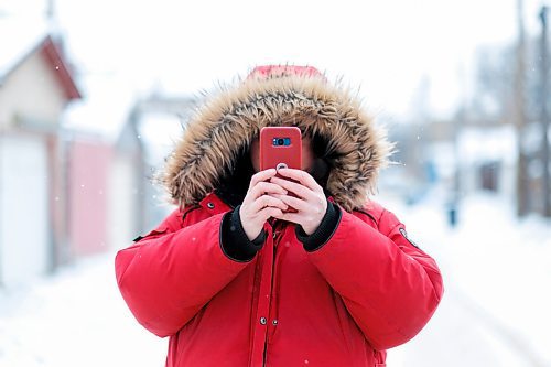 Mike Sudoma / Winnipeg Free Press
The founder and photographer of the growing Instagram account @shoppingcartsofwinnipeg, takes a photo on her phone in a West End back lane Wednesday afternoon while out on the hunt for shopping carts to photograph. 
January 29, 2020