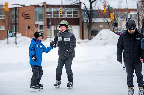 MIKAELA MACKENZIE / WINNIPEG FREE PRESS

James Gao holds onto his son, Jason (11), for balance at a newcomer skating class, hosted by the West End BIZ, in Central Park in Winnipeg on Friday, Jan. 31, 2020. Jason has been playing hockey for five years, but this is his dad's first time on skates in 25 years. Standup.
Winnipeg Free Press 2019.