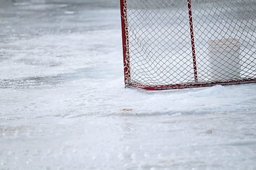 Daniel Crump / Winnipeg Free Press. A hockey net sits on the ice at the Broadway Neighbourhood Centres skating rink. The ice is in very poor condition as the rink has been used as a parking until just a few days ago. February 1, 2020.