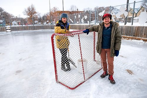 Daniel Crump / Winnipeg Free Press. Simon Dueck (left) and Nathan De Avila (right) have been helping transform the Broadway Neighbourhood Centres skating rink from a parking lot into a skiable ice surface. February 1, 2020.