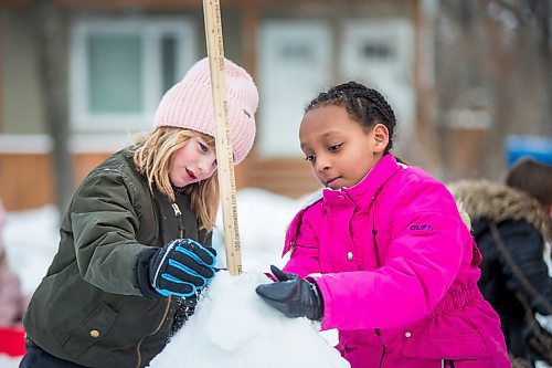 MIKAELA MACKENZIE / WINNIPEG FREE PRESS

Grade 2/3 students Rachael Hayden (left) and Aloniab Kiflom build a snow pyramid at LaVerendrye School as part of the Jack Frost Challenge in Winnipeg on Monday, Feb. 3, 2020. The kids are practicing math estimating and measuring skills, and will make snow sculptures once the snow has solidified for a couple of days. Standup.
Winnipeg Free Press 2019.