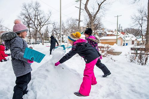 MIKAELA MACKENZIE / WINNIPEG FREE PRESS

Grade 2/3 students Zoe Worn (left), Hannah Moreau, and Tierney Smith build a snow pyramid at LaVerendrye School as part of the Jack Frost Challenge in Winnipeg on Monday, Feb. 3, 2020. The kids are practicing math estimating and measuring skills, and will make snow sculptures once the snow has solidified for a couple of days. Standup.
Winnipeg Free Press 2019.