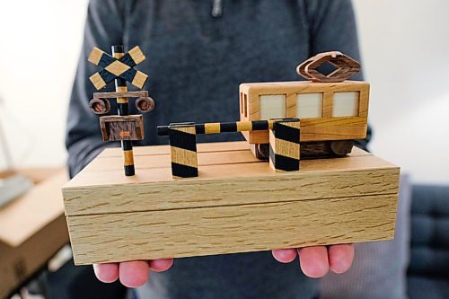 Daniel Crump / Winnipeg Free Press. John Hache holds a puzzle box designed by the Karakuri Group in Japan. While some puzzle boxes are relatively simple other use complex mechanisms such as magnets to add a degree of difficulty. February 3, 2020.