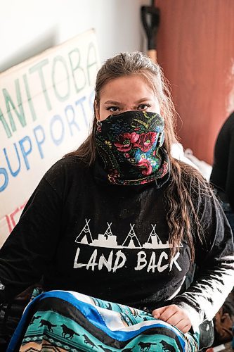 Mike Sudoma / Winnipeg Free Press
WetSuweten supporter, Autumn Emily Amos, sports a mouth cover and a Land Back shirt as she and a group of allies support the peoples of WetSuwetEn as they perform a sit in at Minister of Northern Affairs, Dan Vandals St Vital office Tuesdayy afternoon
February 4, 2020