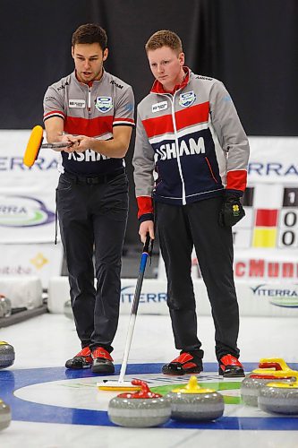 MIKE DEAL / WINNIPEG FREE PRESS
Third, Kyle Kurz (left), and skip, Braden Calvert (right) during their match against Team Gitzel at Eric Coy Arena Wednesday afternoon on day one of the 2020 Viterra Curling Championship.
200205 - Wednesday, February 05, 2020.