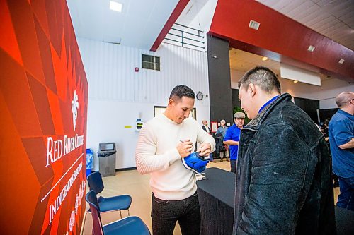 MIKAELA MACKENZIE / WINNIPEG FREE PRESS

Former NHL forward Jordin Tootoo signs Hayden Whiteway's shoe at Red River College in Winnipeg on Wednesday, Feb. 5, 2020. For Sol Israel story.
Winnipeg Free Press 2019.