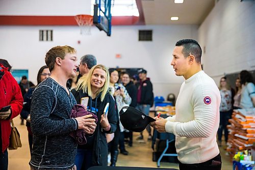 MIKAELA MACKENZIE / WINNIPEG FREE PRESS

Former NHL forward Jordin Tootoo talks to Scott Chevalier after signing his cap at Red River College in Winnipeg on Wednesday, Feb. 5, 2020. For Sol Israel story.
Winnipeg Free Press 2019.