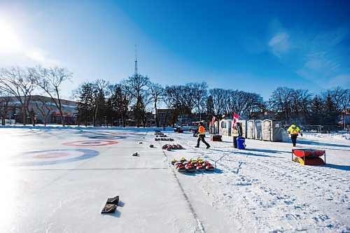 MIKAELA MACKENZIE / WINNIPEG FREE PRESS

Volunteers Mike Sokil (left), Brendan Bayne, and Franklin Odidison hang out after setting up for the Ironman Outdoor Curling Bonspiel in Memorial Park in Winnipeg on Friday, Feb. 7, 2020. 
Winnipeg Free Press 2019.