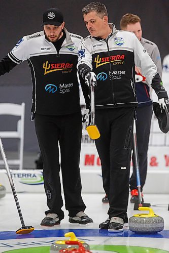 MIKE DEAL / WINNIPEG FREE PRESS
Skip William Lyburn (right) talks to third, Daley Peters, during his teams match against Team Calvert at Eric Coy Arena Friday morning on day three of the 2020 Viterra Curling Championship.
200207 - Friday, February 07, 2020.