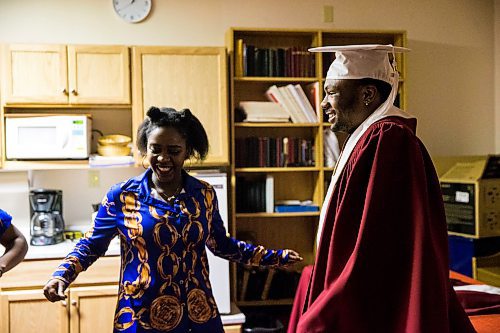 MIKAELA MACKENZIE / WINNIPEG FREE PRESS

Graduate Daniel Pembele dances with friend Plamedie Gatoro before the first-ever Freedom International School (a Christian private school for at-risk refugee students) graduation in Winnipeg on Friday, Feb. 7, 2020.  For Maggie Macintosh story.
Winnipeg Free Press 2019.