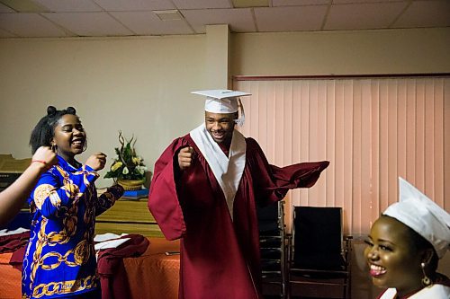 MIKAELA MACKENZIE / WINNIPEG FREE PRESS

Graduate Daniel Pembele dances with friend Plamedie Gatoro before the first-ever Freedom International School (a Christian private school for at-risk refugee students) graduation in Winnipeg on Friday, Feb. 7, 2020.  For Maggie Macintosh story.
Winnipeg Free Press 2019.