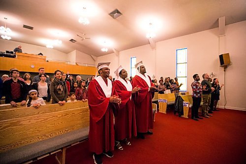 MIKAELA MACKENZIE / WINNIPEG FREE PRESS

Graduates Daniel Pembele (left), Devotha Kwizera, and Prince Busime sing and clap their hands at the first-ever Freedom International School (a Christian private school for at-risk refugee students) graduation in Winnipeg on Friday, Feb. 7, 2020.  For Maggie Macintosh story.
Winnipeg Free Press 2019.