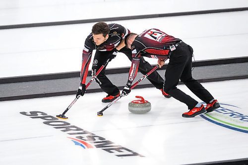 Daniel Crump / Winnipeg Free Press. Alex Forrest (left) and Connor Njegovan (rigtht) of the Gunnlaugson rink sweep during the 2020 Viterra Championship at Eric Coy Arena. February 9, 2020.