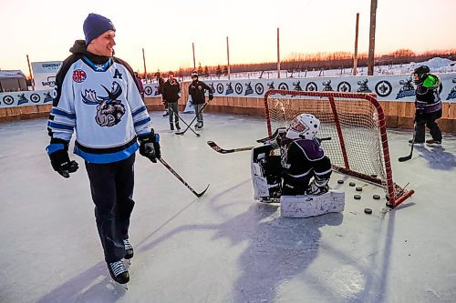 Daniel Crump / Winnipeg Free Press. Manitoba Moose defensemen Nelson Nogier skates with kids on the Glawson familys backyard rink. February 10, 2020.