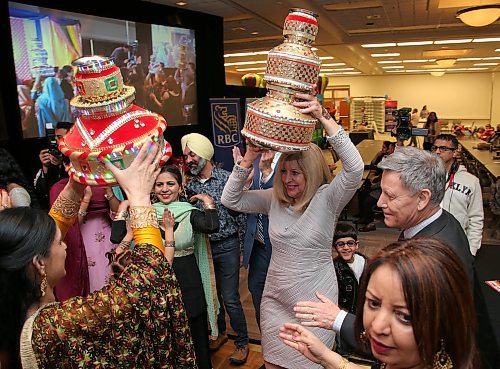 JASON HALSTEAD / WINNIPEG FREE PRESS

Cathy Cox (Manitoba Minister of Sport, Culture and Heritage) and Terry Duguid (Member of Parliament for Winnipeg South) take part in the Jago dance at the Lohri Mela celebration at the RBC Convention Centre Winnipeg on Jan. 11, 2020. (See Social Page)