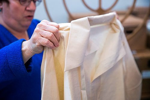 MIKAELA MACKENZIE / WINNIPEG FREE PRESS

Rina Boroditzky, executive director of the Chesed Shel Emes Funeral Home, shows shrouds in the chapel in Winnipeg on Wednesday, Feb. 12, 2020. For Brenda Suderman story.
Winnipeg Free Press 2019.