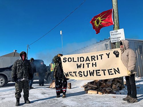 Danielle DaSilva / Winnipeg Free Press
Demonstrators block a portion of the Canadian National rail line just north of Wilkes in Diamond, MB, Wednesday morning. The blockade, about 25 kilometres from Winnipeg, is in solidarity with ongoing efforts to block a pipeline on traditional Wetsuweten territory in British Columbia. 
200212 - Wednesday, February 12, 2020.