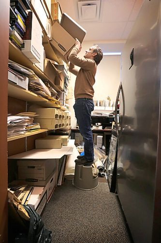 RUTH BONNEVILLE  /  WINNIPEG FREE PRESS 

FAITH - Religious archives story for 49.8

Archivist,  Andrew Morrison, stands on a stool in a room full of newly received documents that still need to be organized and archived.

STORY INFO: At the Jewish Heritage Centre, executive director Belle Jarniewski also struggles to find space for the many items in the collectionmore than 70,000 photos, 1,300 sound and moving image recordings, 1,000 textual records, 200 bound volumes of newspapers, and over 4,000 artefacts."
They have hired a part-time archivist (Andrew Morrison) to handle all the new incoming documents but it's not enough to keep up.


See story by John Longhurst

Feb 5th, 2020
