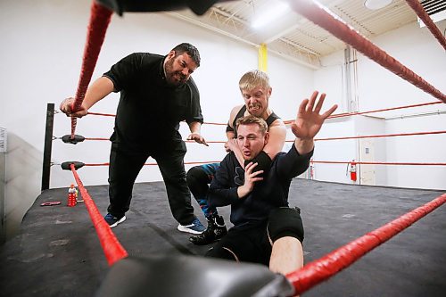 JOHN WOODS / WINNIPEG FREE PRESS
Wrestlers AJ Larocque, left, aka AJ Sanchez looks on as George Hudson, aka Dash Royal, puts Steven Stashko into a chin lock during training Wednesday, February 12, 2020. Wrestling involves artistry, performance and storytelling.

Reporter: Koncan