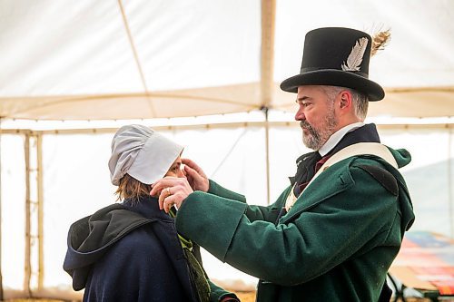 MIKAELA MACKENZIE / WINNIPEG FREE PRESS

Official family member Robert Régnier fixes Liliane Régnier's cap before the Festival du Voyageur press conference kickoff at in Winnipeg on Thursday, Feb. 13, 2020. For Ben Waldman (?) story.
Winnipeg Free Press 2019.