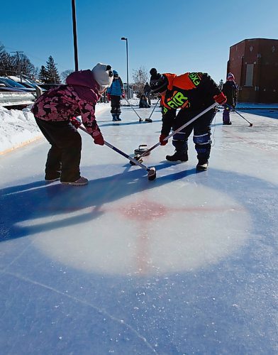 MIKE DEAL / WINNIPEG FREE PRESS
Seanna (left) and Doug (right) sweep during gym class on the homemade curling rink behind Prince Edward School in River-East Transcona.
200213 - Thursday, February 13, 2020.