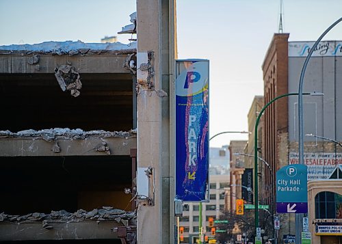Mike Sudoma / Winnipeg Free Press
The civic parkade sign hangs on as demolition of the Civic Parkade attached to the Public Safety Building continues Thursday
February 13, 2020