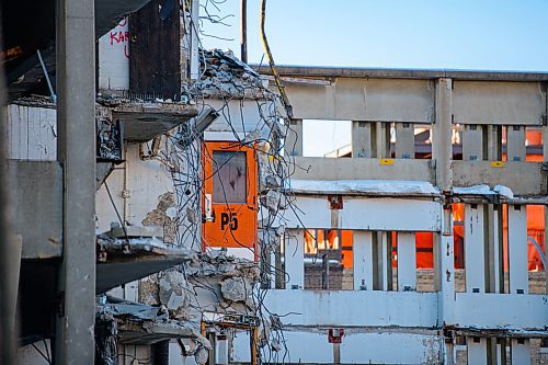 Mike Sudoma / Winnipeg Free Press
An orange, fifth floor door that once led to a stairwell inside of the remains of the Public Safety Buildings Parkade as demolition of the building continues Thursday afternoon.
February 13, 2020