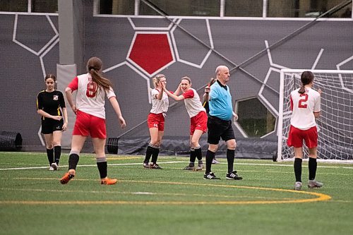 Mike Sudoma / Winnipeg Free Press
Hanover Fusion offence (left to right) Paige Heide, gets high five from fellow player Kate Bourgouin after scoring the first goal of their game against Winakwa Community Club during the Golden Boy Tournament Thursday evening at the Duckworth Centre.
February 13, 2020