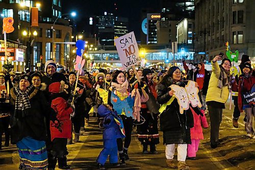 Daniel Crump / Winnipeg Free Press. Participants hold signs and chant as the march down Portage Avenue during the Annual Manitoba Womens Memorial March in honour of MMIWG & 2SLGBTQQIA. February 14, 2020.