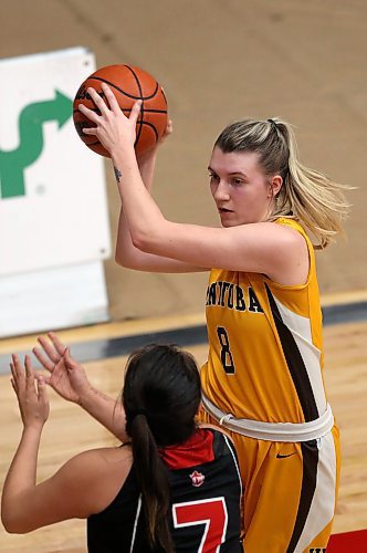 SHANNON VANRAES / WINNIPEG FREE PRESS
Robyn Boulanger of the University of Winnipeg Wesmen attempts to block a pass by Emma Thompson of the University of Manitoba Bisons during a Canada West Play-In Game at the Duckworth Centre on February 14, 2020.