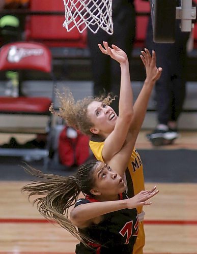 SHANNON VANRAES / WINNIPEG FREE PRESS
Jillian Duncan of the University of Winnipeg Wesmen and  Keziah Brothers of the University of Manitoba Bisons both leap for the ball during a Canada West Play-In Game at the Duckworth Centre on February 14, 2020.