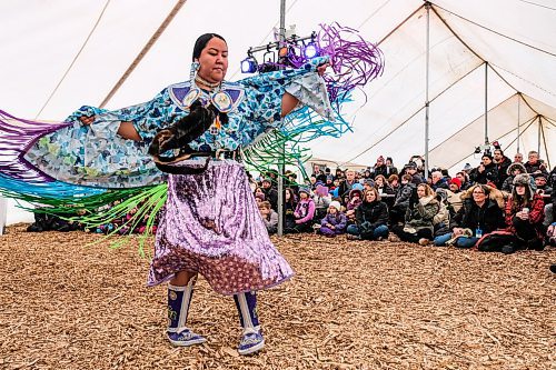 Daniel Crump / Winnipeg Free Press. Visitors watch Fancy Shawl Dancer Robin Parisian perform a dance during the first Saturday of Festival du Voyageur. February 15, 2020.