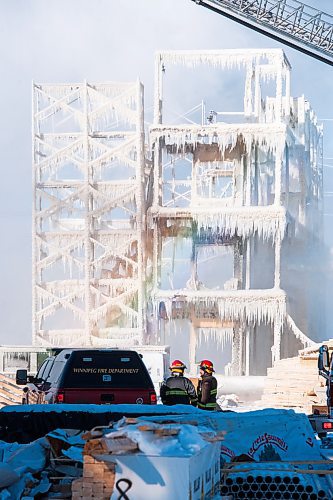 Mike Sudoma / Winnipeg Free Press
Members of the Winnipeg Fire Department look over at the frozen remains of a condo project off of Phillip Lee Drive which went up in flames around 6 am Sunday morning.
February 16, 2020