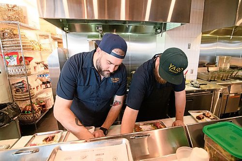 Mike Sudoma / Winnipeg Free Press
Yard Sale/Good Fight Tacos Kitchen Manager, Steven Toews (left) and cook Brian Rivers (right) prepare tacos inside the join restaurant Sunday afternoon inside of Hargrave Market.
February 16, 2020