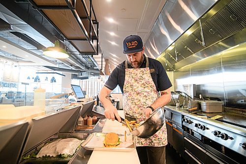 Mike Sudoma / Winnipeg Free Press
Yard Sale/Good Fight Tacos Kitchen Manager, Steven Toews doles out some fries to go along with the 342 Burger inside the join restaurant Sunday afternoon inside of Hargrave Market.
February 16, 2020