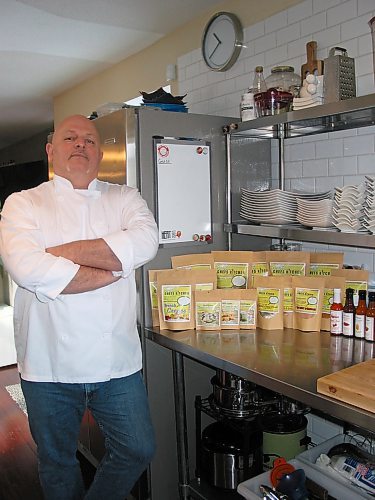 Canstar Community News Feb. 11, 2020 - Steve Hunt-Lesage, a Fort Richmond resident who owns and operates fat Iguana Kitchen, is shown with the ready-to-prepare meals, soup, salad dressing, crepe and biscuit mixes and bottled sauces that he and his family prepare and package in the commercial kitchen at the Caisse Community Centre in La Salle. (ANDREA GEARY/CANSTAR COMMUNITY NEWS)
