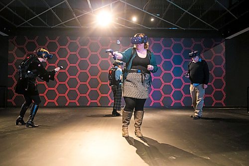 MIKAELA MACKENZIE / WINNIPEG FREE PRESS

Free Press reporter Erin Lebar (centre) tries out the VR games at The Rec Room entertainment centre in Winnipeg on Wednesday, Feb. 19, 2020. For Randall/Erin/Frances story.
Winnipeg Free Press 2019.