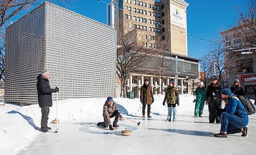 MIKE DEAL / WINNIPEG FREE PRESS
Greg Tonn, owner of Into the Music, throws a rock at the Old Market Square curling rink during a friendly match over the noon-hour.
Mayor Brian Bowman and councillors Vivian Santos, John Orlikow, and Sherri Rollins battled it out Canadian winter prairie style in a friendly curling match against Exchange District BIZ Executive Director David Pensato and local business owners Chris Graves of The Kings Head, Amie Seier of Community Gym and Greg Tonn, owner of Into the Music, at the Old Market Square community rink.
200219 - Wednesday, February 19, 2020.