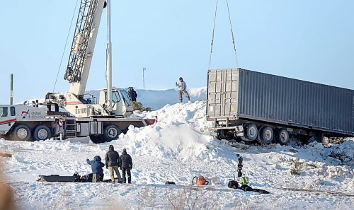 RUTH BONNEVILLE  /  WINNIPEG FREE PRESS 

Local - Standup Movie scene
Film crews work on a movie involving  a semi-trailer and a crane that look to be involved in an accident  on the east side of Garbage Hill (Westview Park) Thursday.
- production scene from a new action-thriller starring Liam Neeson filming in Manitoba that began earlier this month February.

The film titled The Ice Road tells the fictional story of a mine that collapses in northern Canada, trapping some of the miners. In order to bring those who are trapped to safety, rescuers must carry heavy equipment in 18-wheelers over ice roads, which are thinning out as the season comes to an end. Liam Neeson stars as the hero driver doing what it takes to save those in danger.


Feb 20th, 2020
