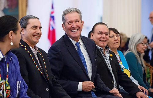 MIKE DEAL / WINNIPEG FREE PRESS
(From left) Elder Francis, AMC Grand Chief Arlen Dumas, Premier Brian Pallister, Manitoba Keewatinowi Okimakanak Grand Chief Garrison Settee, Mathias Colomb Cree Nation Chief Lorna Bighetty, War Lake FN Chief Betsy Kennedy. 
Premier Brian Pallister laughs prior to the start of the signing ceremony of a memorandum of understanding to formalize discussions toward an agreement on the transfer of the provinces northern airports and marine operations to First Nations ownership and operation, Thursday morning in the Manitoba Legislative building.  
200220 - Thursday, February 20, 2020.