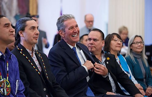 MIKE DEAL / WINNIPEG FREE PRESS
(From left) Elder Francis, AMC Grand Chief Arlen Dumas, Premier Brian Pallister, Manitoba Keewatinowi Okimakanak Grand Chief Garrison Settee, Mathias Colomb Cree Nation Chief Lorna Bighetty, War Lake FN Chief Betsy Kennedy. 
Premier Brian Pallister laughs prior to the start of the signing ceremony of a memorandum of understanding to formalize discussions toward an agreement on the transfer of the provinces northern airports and marine operations to First Nations ownership and operation, Thursday morning in the Manitoba Legislative building.  
200220 - Thursday, February 20, 2020.