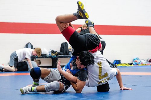 Daniel Crump / Winnipeg Free Press.¤Khaled Aldrar (blue) wrestles with Fahed Ahmad (white) during a team practice. February 20, 2020.