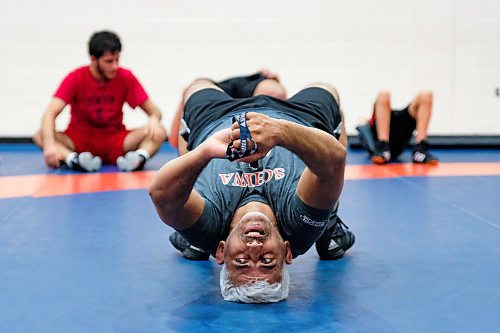 Daniel Crump / Winnipeg Free Press.¤Mohammad Aldrar, assistant coach at¤Schewa Wrestling Club, demonstrates a movement exercise during team training. February 20, 2020.