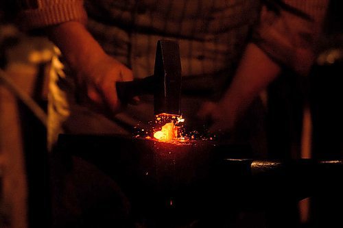 Mike Sudoma / Winnipeg Free Press
Blacksmith, Dylan Preece, works on a project Friday evening inside the Forge at Festival Du Voyaguer Friday evening
February 16, 2020