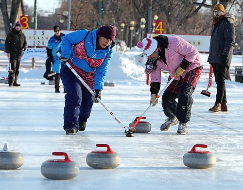 JASON HALSTEAD / WINNIPEG FREE PRESS

Silicon Valley Hacks team members Julie Wolf (left) and Richard Lazarowich sweep a stone into the house at the 19th annual Ironman Outdoor Curling Bonspiel on Feb. 8, 2020 in Memorial Park. (See Social Page)