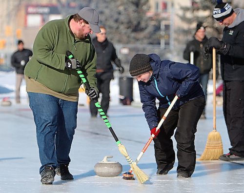 JASON HALSTEAD / WINNIPEG FREE PRESS

From left, team Hack Job members Dave Vandrogelen and Lauren Canning sweep during the championship game agains the team, I Swept with Your Wife, at the 19th annual Ironman Outdoor Curling Bonspiel on Feb. 9, 2020 in Memorial Park. (See Social Page)